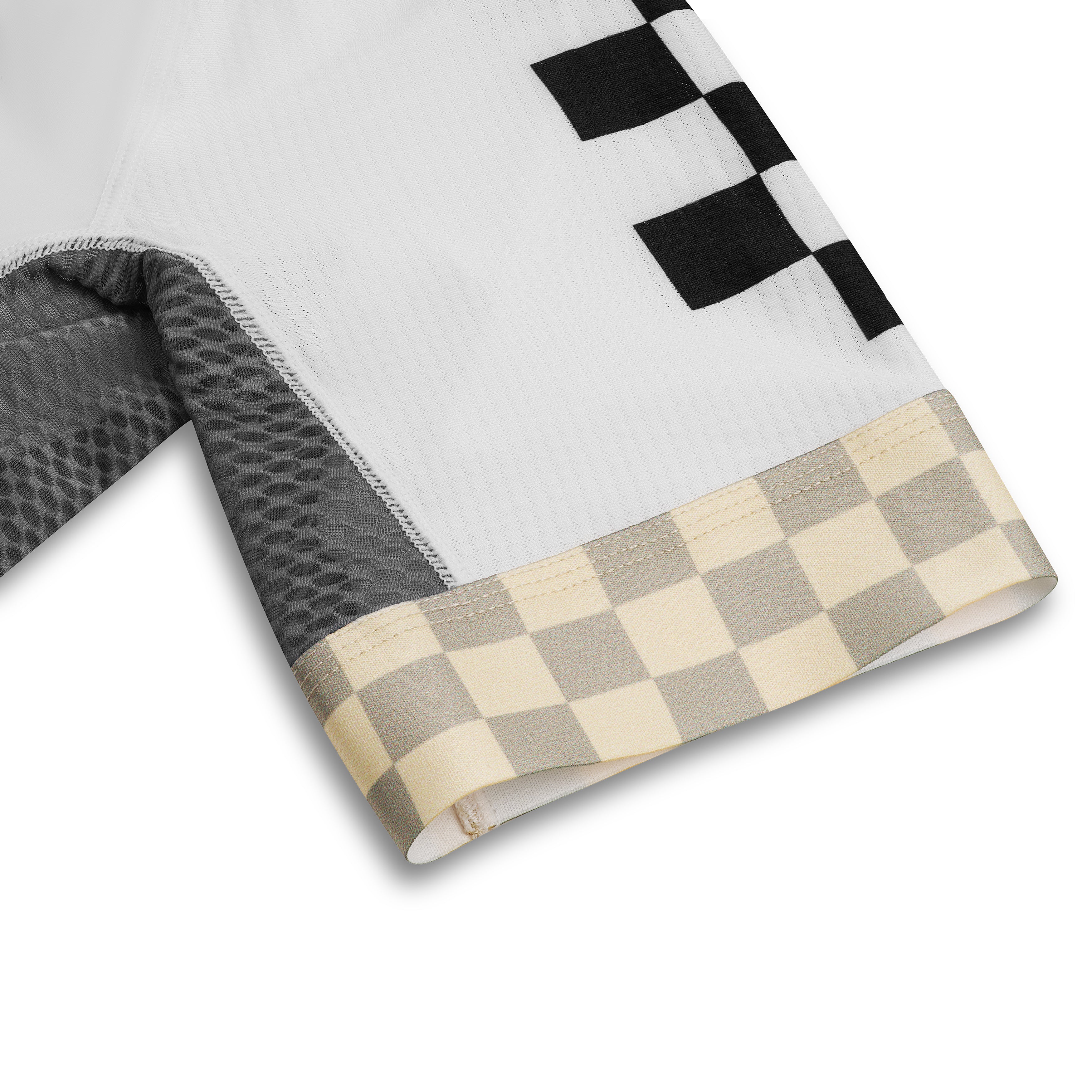 Close-up of white cuff and black checkerboard sleeve of the white race jersey.