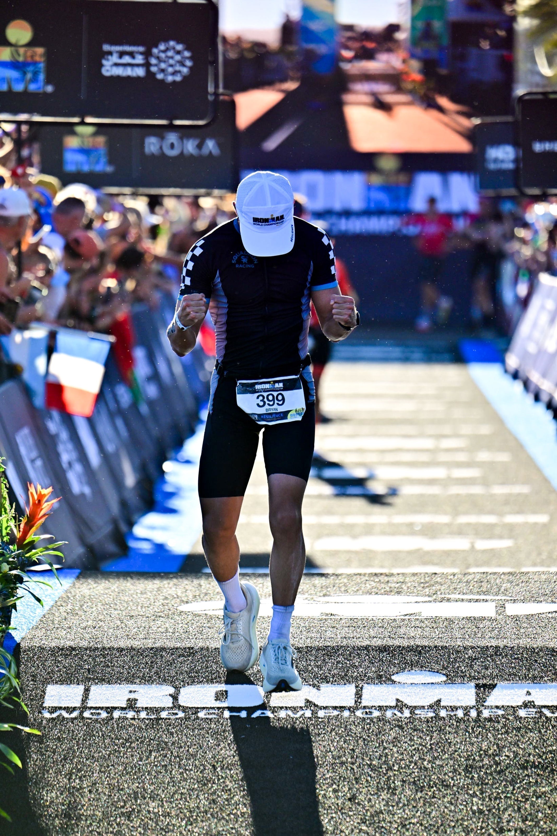 Athlete finishing the Ironman World championship triathlon.