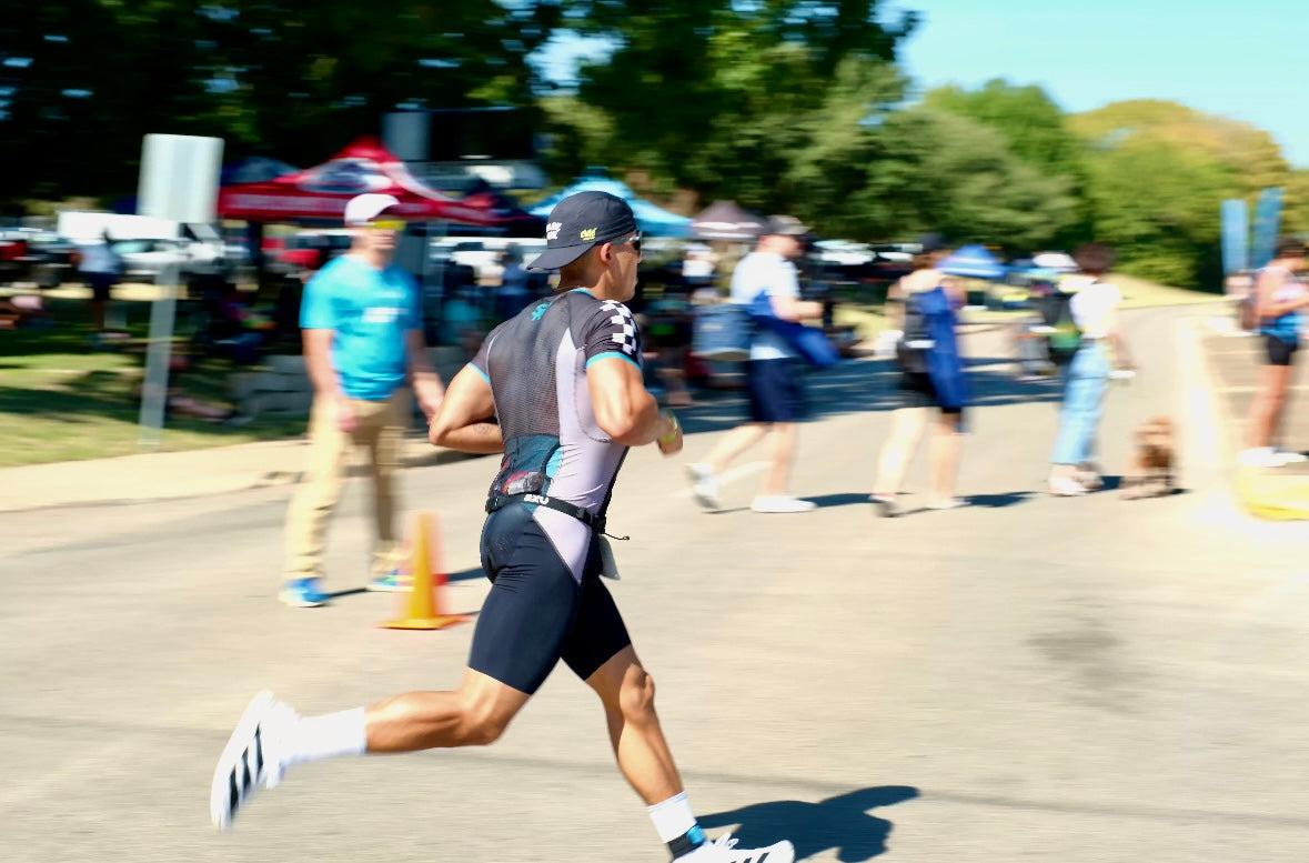 Triathlete running Ironman Waco 70.3 in the Squadron racing triathlon suit.
