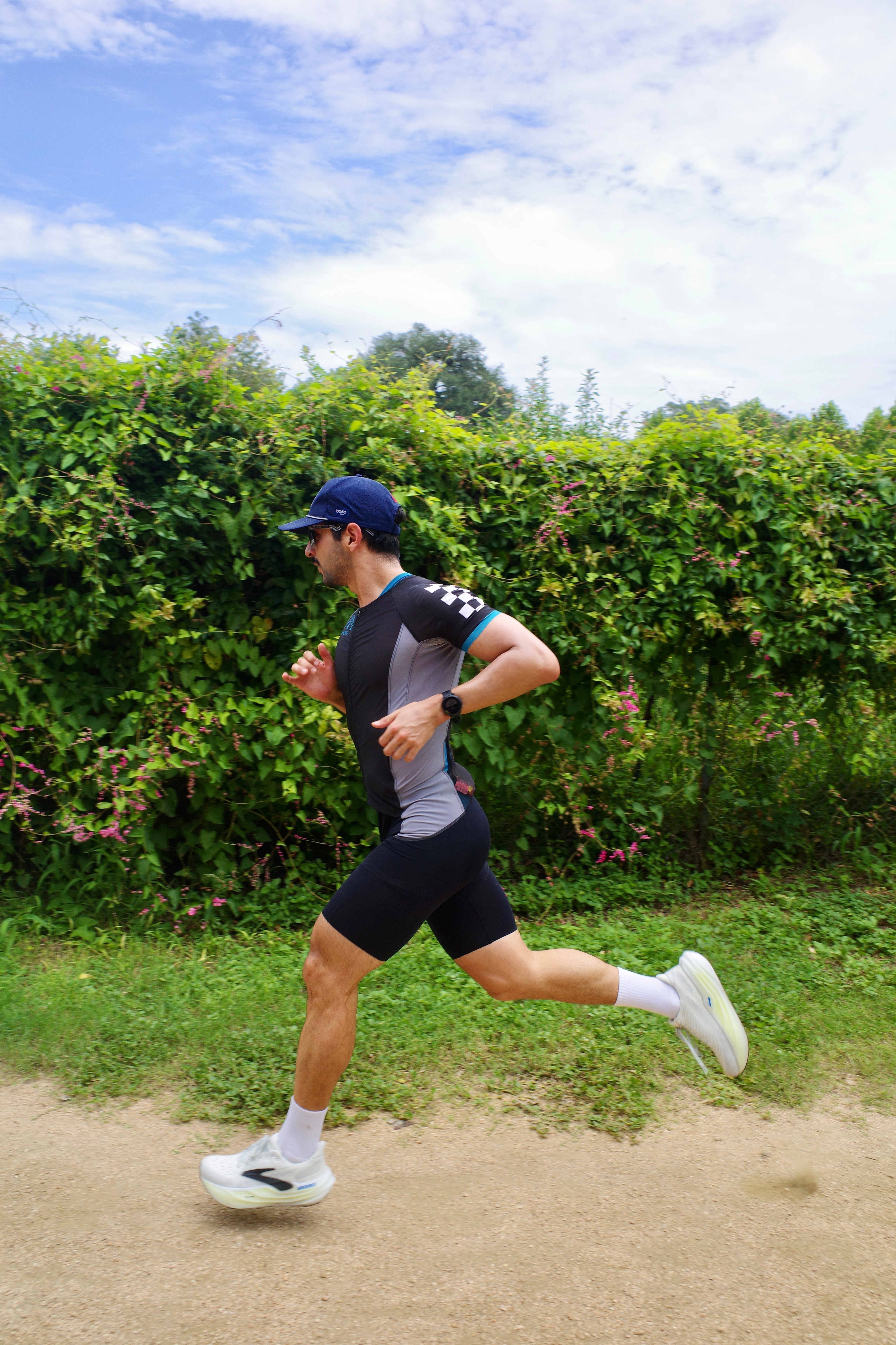 Squadron Racing athlete running in a triathlon suit