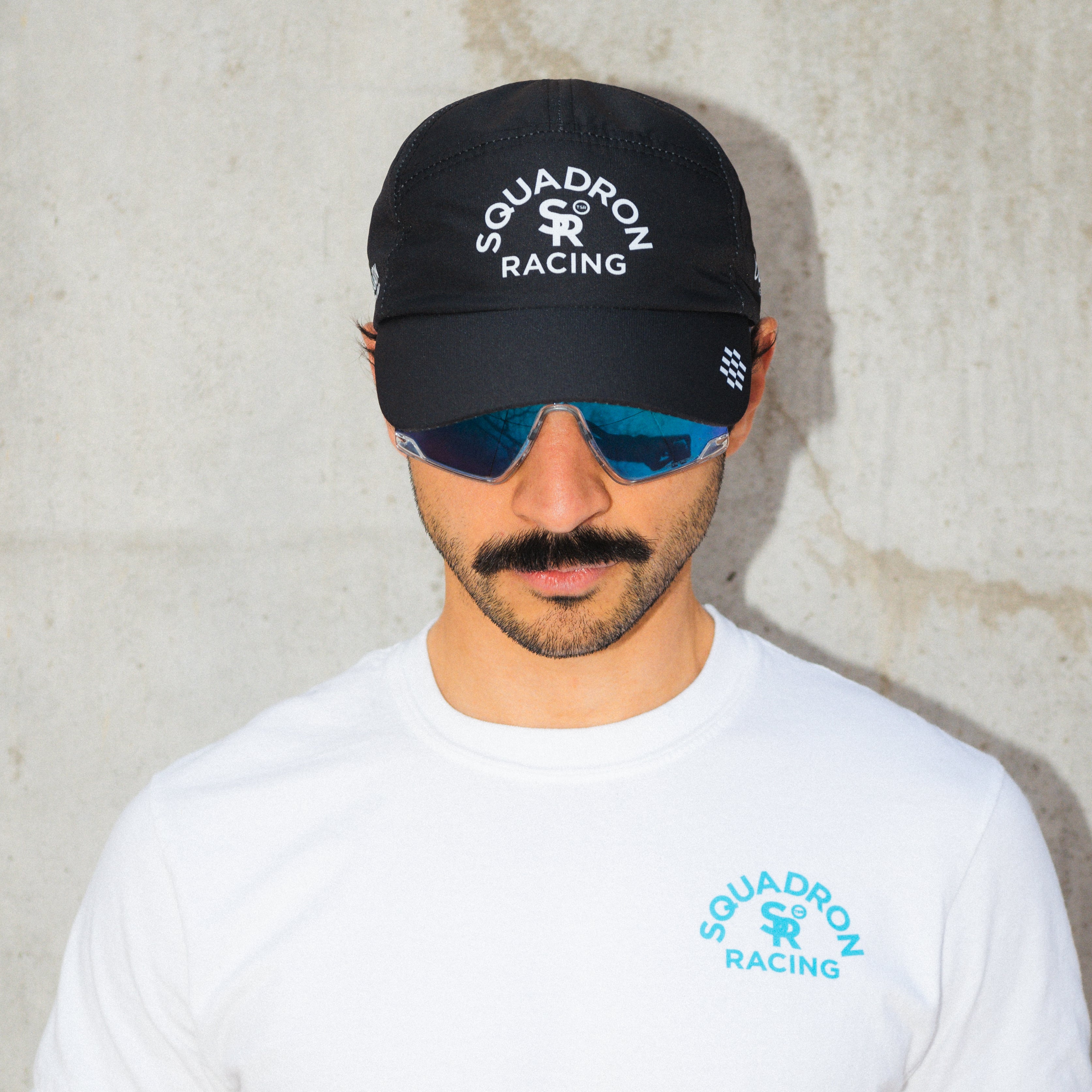 Athlete wearing the squadron racing black hat.