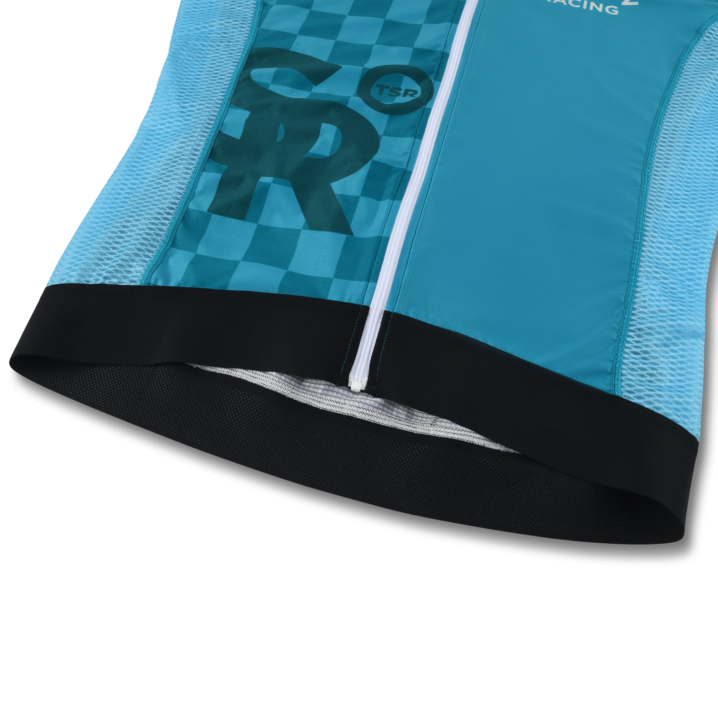 Lower back hem of blue jersey showing grip fabric and design lines.