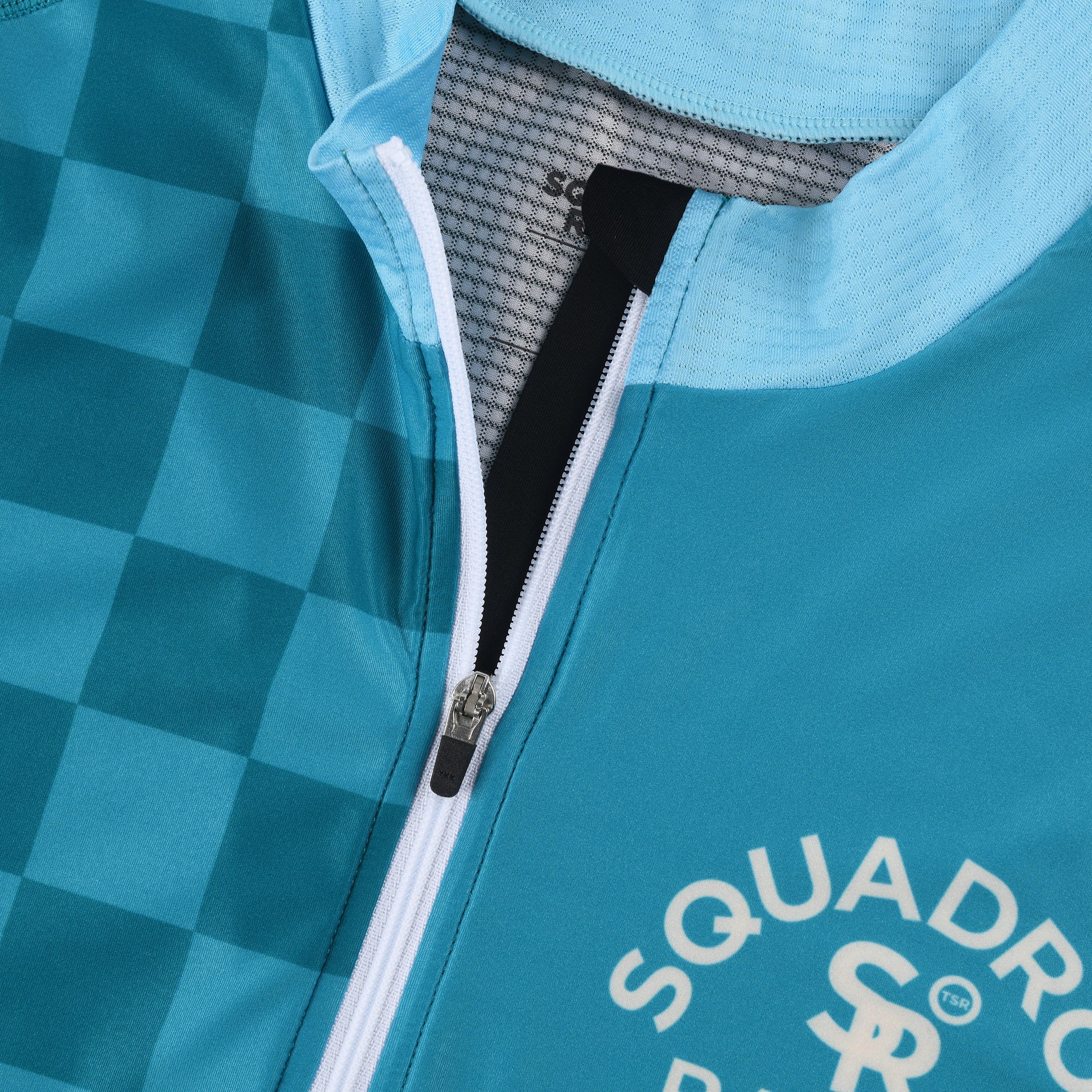 Close-up of blue jersey collar and zipper construction.