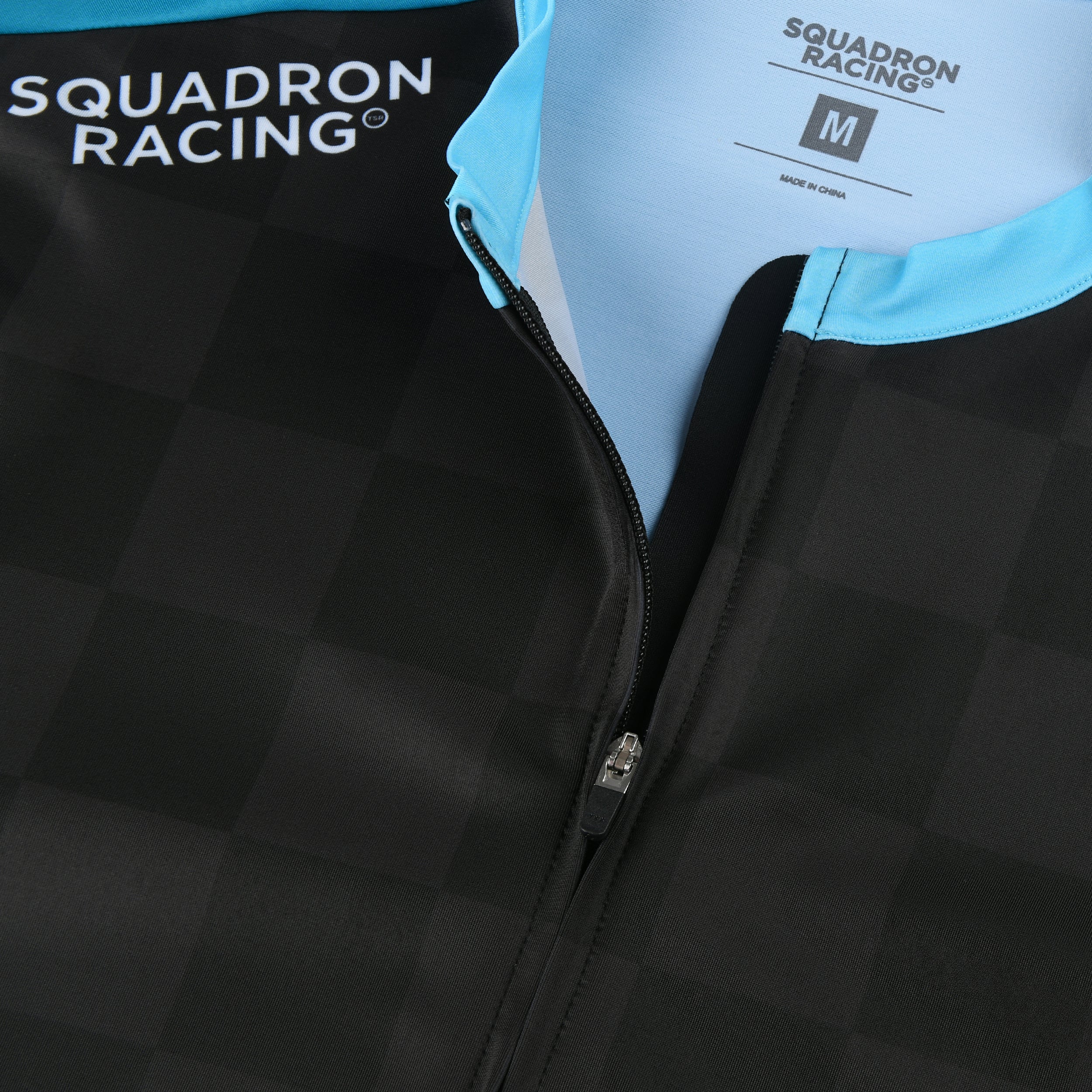 Close-up of zip and collar area with Squadron Racing branding and tag visible.