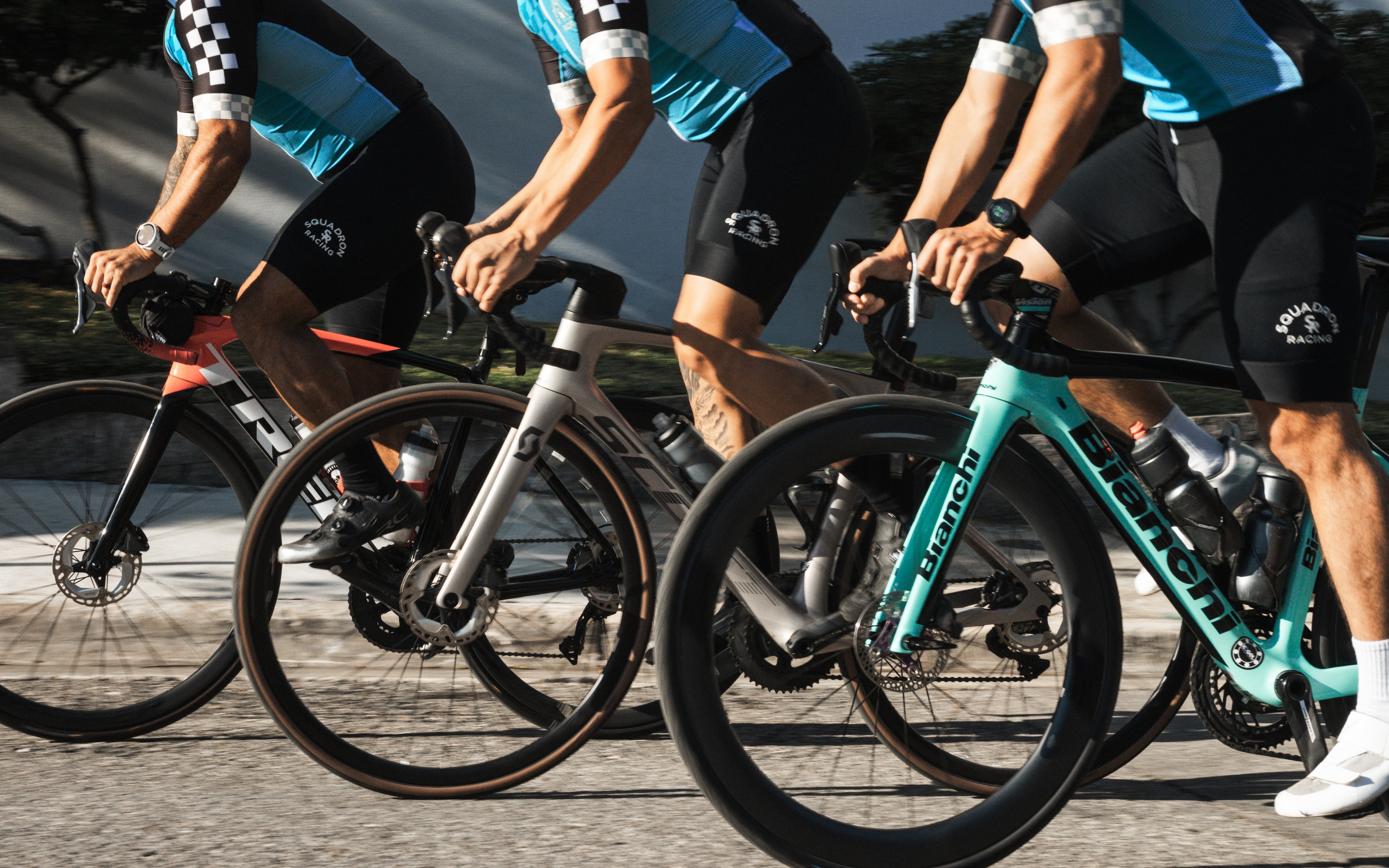 Cyclists wearing bib shorts during a race, demonstrating gear in action.

